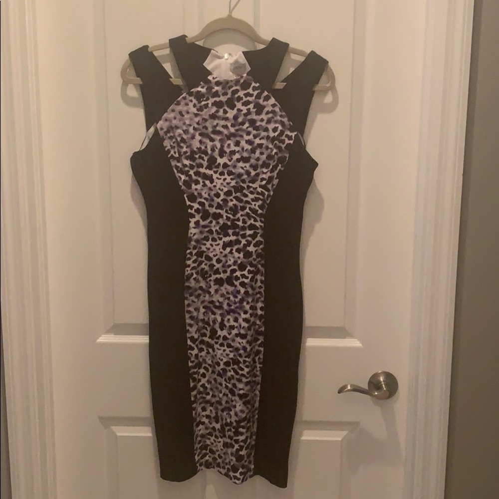 Cut out dress size 8. Leopard spots make it edgy